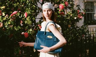 Model layin and holding Bayswater Crumpet