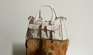 model wearing Mulberry mini Roxanne shoulder bag in sage green