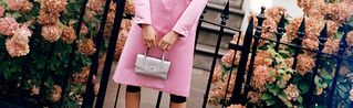 Model holding the Mulberry Darley Top Handle Bag in Silver