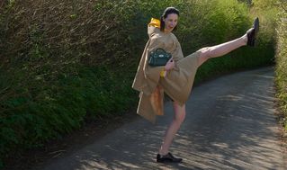 Female model wearing Mulberry Mini Alexa in dark green leather