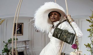 model wearing Mulberry mini Roxanne shoulder bag in sage green