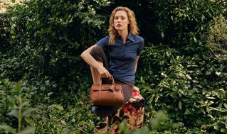 Model layin and holding Bayswater Crumpet